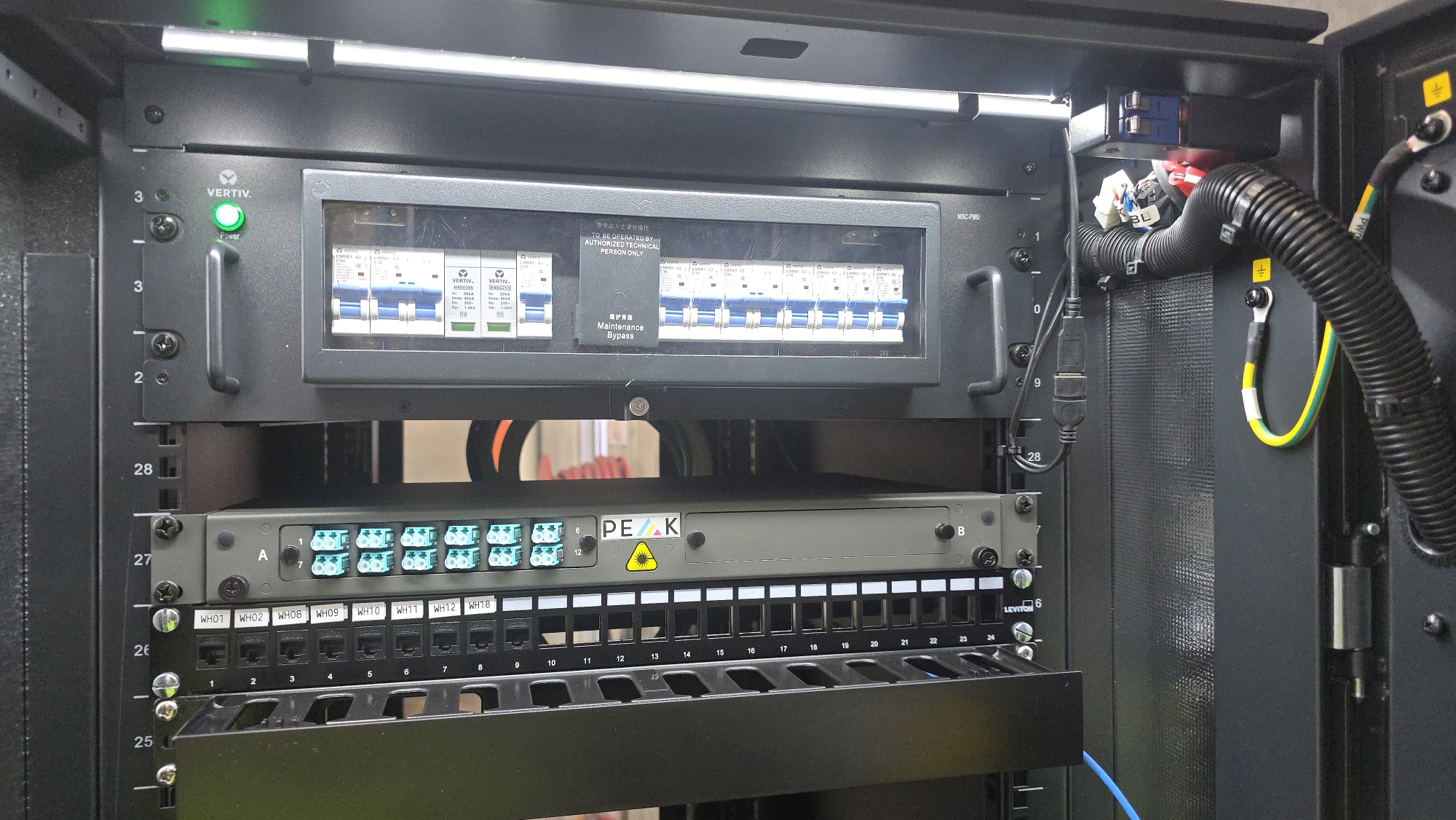 Vertiv cabinet top with Peak fibre panel and labelled ports